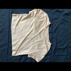Shein XS nude crop top. The picture makes it look lighter but it’s a darker nude